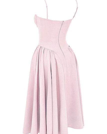 Light pink corset midi dress angled back view showing fitted bodice seams and flared pleated skirt