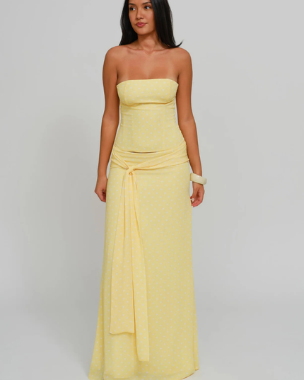 Yellow polka dot strapless corset maxi dress with tie-front sash, full length front view