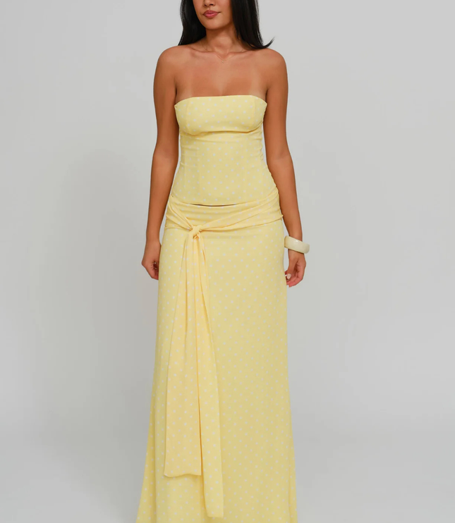 Yellow polka dot strapless corset maxi dress with tie-front sash, full length front view