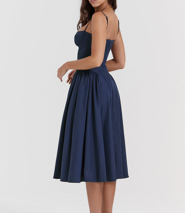 Navy corset midi dress side view showing fitted waist, thin straps, and voluminous midi skirt