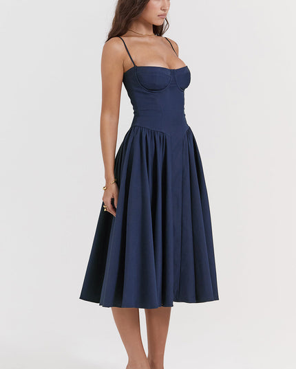 Navy corset midi dress three-quarter view highlighting structured bust cups and gathered skirt