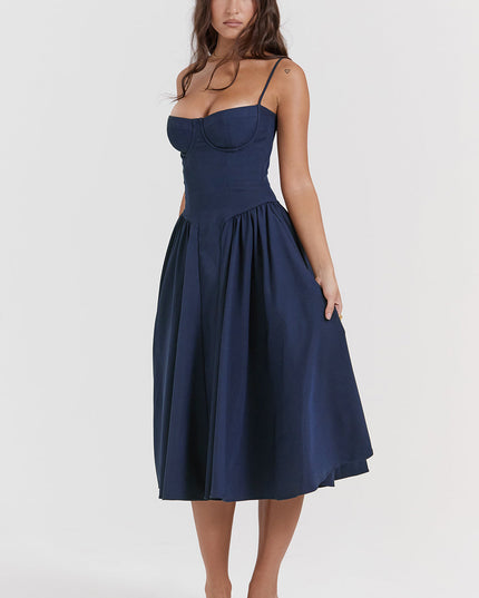 Navy corset midi dress front pose with flared skirt drape, underwire bodice, and spaghetti straps
