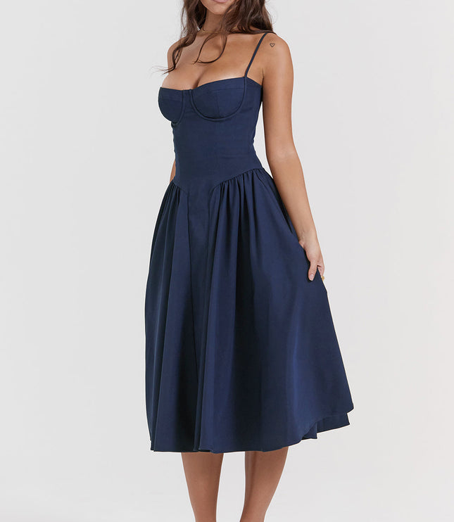 Navy corset midi dress front pose with flared skirt drape, underwire bodice, and spaghetti straps