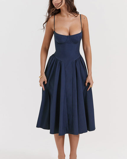 Navy corset midi dress front view with head turned, featuring underwire cups and full midi skirt