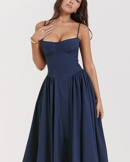 Navy corset midi dress close-up showing underwire bust detail, thin straps, and structured bodice seams