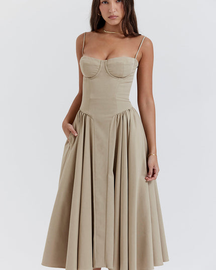 Beige corset midi dress three quarter view with structured bodice seams and gathered skirt