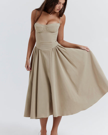 Beige corset midi dress action shot with flared skirt held out to show volume and drape