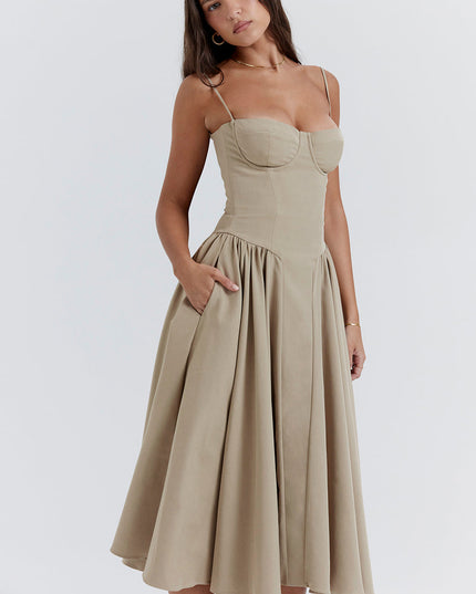 Beige corset midi dress angled view showing bodice structure, thin straps, and flowing skirt