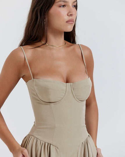 Closeup of taupe corset midi dress bodice showing underwire cups, seam detailing, and spaghetti straps
