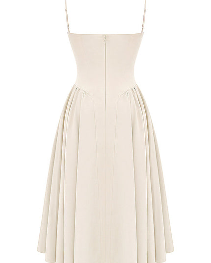 Back view of ivory corset midi dress with thin straps, center zipper, and pleated midi skirt