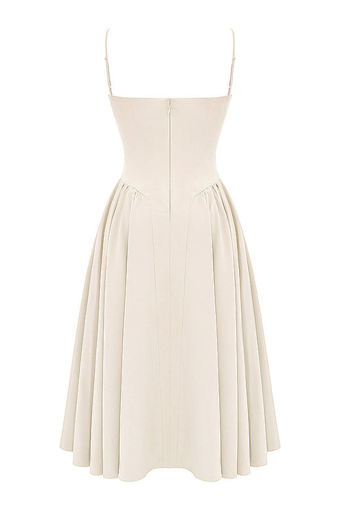 Back view of ivory corset midi dress with thin straps, center zipper, and pleated midi skirt