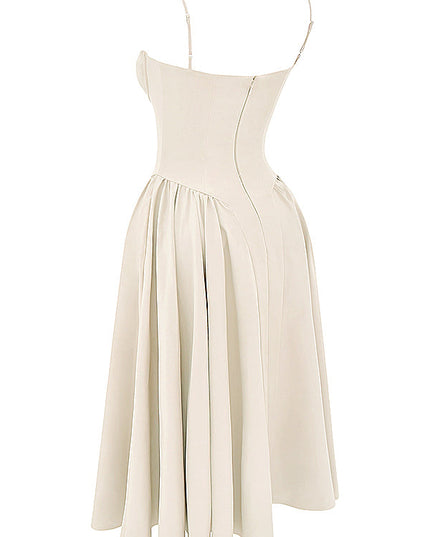 Angled side view of ivory corset midi dress showing structured bodice seams and flared pleated skirt