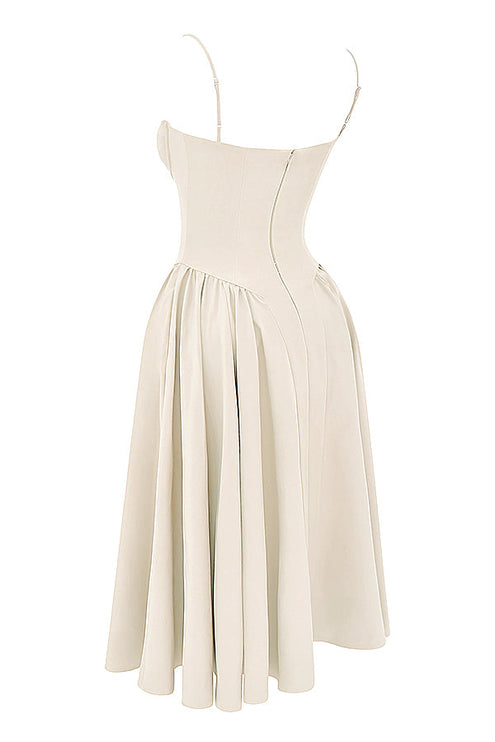 Angled side view of ivory corset midi dress showing structured bodice seams and flared pleated skirt