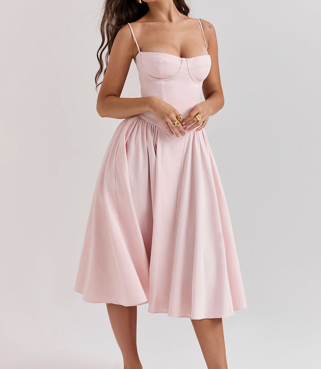 Blush pink corset midi dress front pose highlighting structured bustier bodice and gathered skirt
