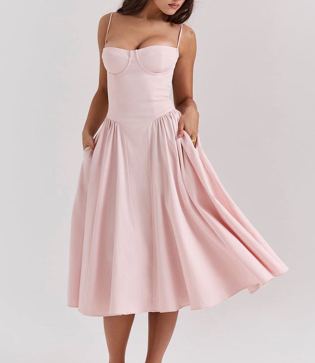 Blush pink corset midi dress three-quarter view with sweetheart neckline and flared midi skirt