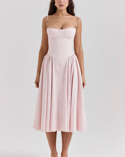 Blush pink corset midi dress front view with sweetheart bustier, thin straps, and full pleated skirt