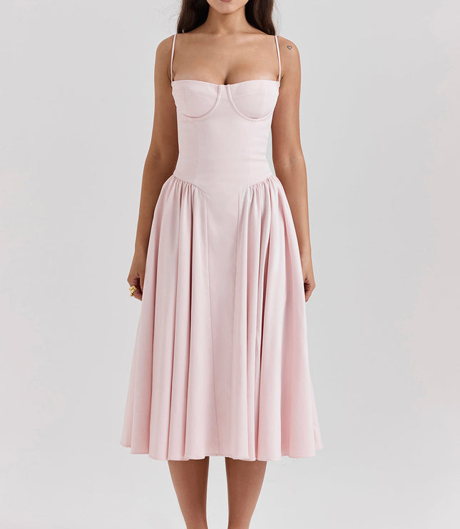 Blush pink corset midi dress front view with sweetheart bustier, thin straps, and full pleated skirt