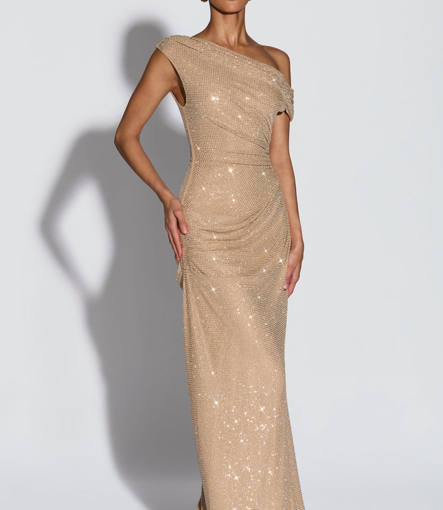 Three-quarter view of champagne off-shoulder sequin maxi dress with fitted waist and draped ruching