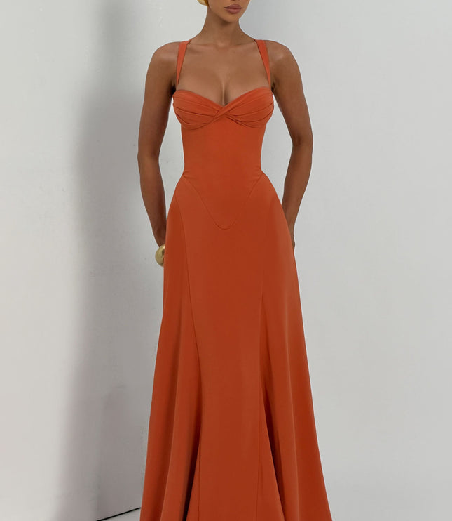 Full length coral pleated maxi dress with twisted bust and wide straps, studio front view