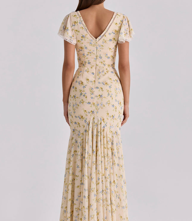 Back view of cream floral maxi dress with lace-trim V-back, flutter sleeves, and center seam