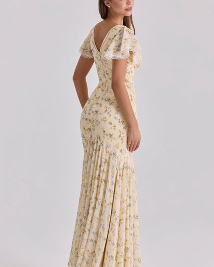 Cream floral lace-trim maxi dress back angle showing flutter sleeves and fitted waist seam