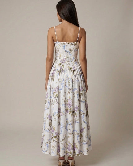Back view of ivory floral corset midi dress with thin straps and full gathered skirt