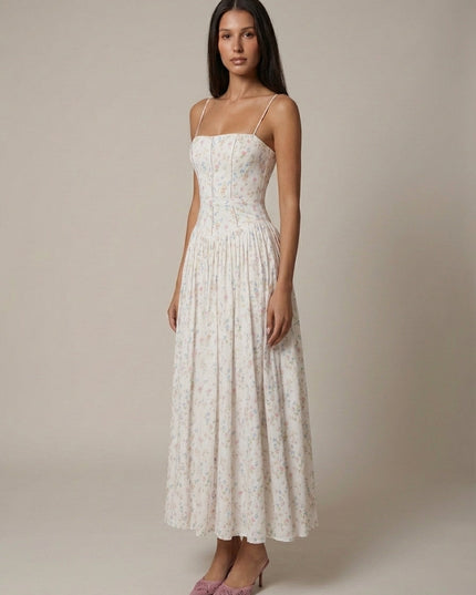 White ditsy floral corset midi dress with fitted bodice and full skirt, angled front view