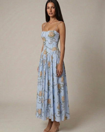 Light blue floral corset midi dress with structured bodice and flowy skirt, side angle view