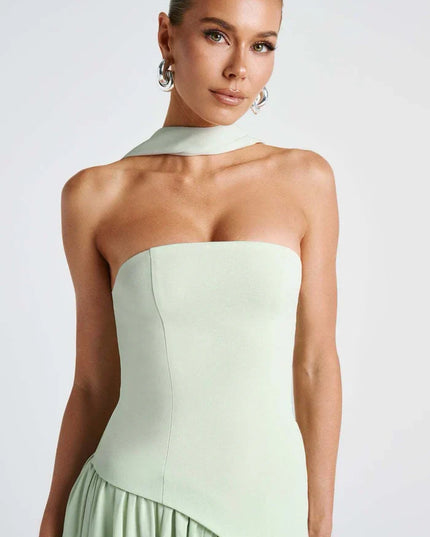 Light green halter maxi dress with strapless bodice, scarf neck tie, and draped skirt