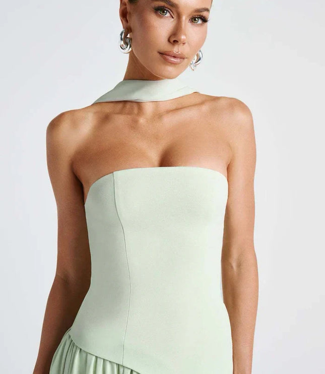 Light green halter maxi dress with strapless bodice, scarf neck tie, and draped skirt