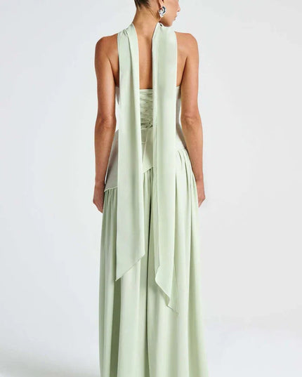 Back view of light green halter maxi dress with long scarf ties and lace-up bodice