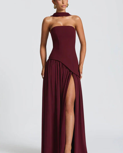 Front view of burgundy halter maxi dress with thigh slit and flowing skirt