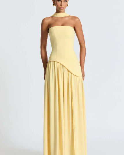 Pale yellow halter maxi dress with fitted strapless bodice and flowing skirt front view
