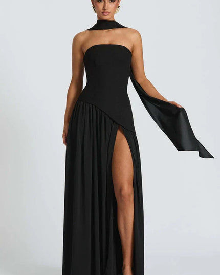 Black halter maxi dress with strapless neckline, high side slit, and long draped scarf