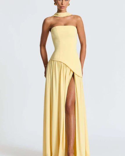 Pale yellow halter maxi dress showing the strapless bodice and high slit from the front