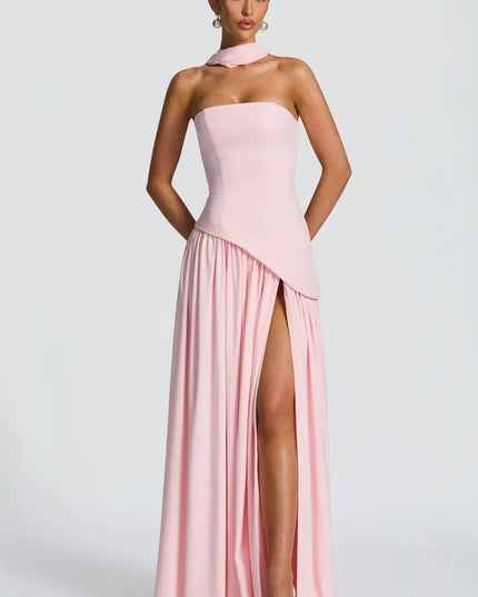 Pink halter maxi dress with strapless bodice and high slit, front view