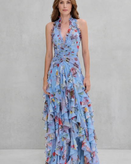 Front view of light blue floral halter maxi dress with ruffled trim neckline and tiered chiffon skirt