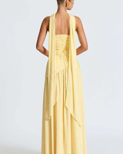 Pale yellow halter maxi dress with long back scarf detail and open back view