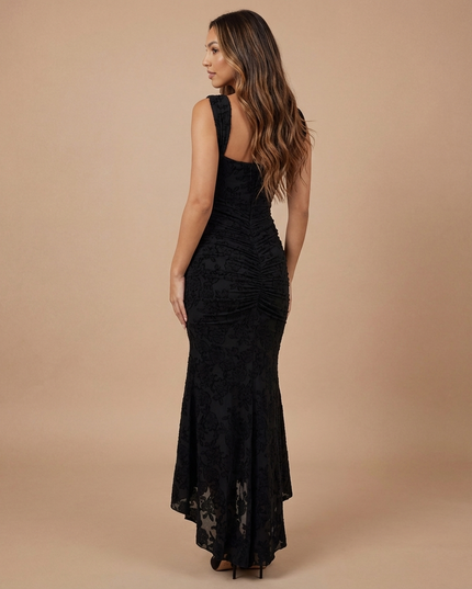 Black lace midi dress back three-quarter view with gathered center back ruching and high-low skirt