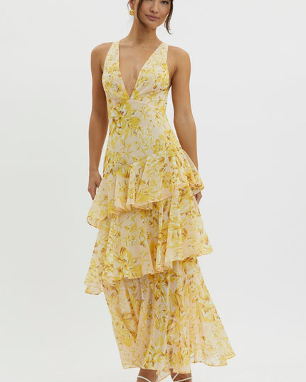 Yellow floral ruffled maxi dress angled view highlighting cascading tiered skirt and v-neck
