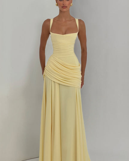 Close-up of pale yellow satin maxi dress bodice with square neck, wide straps, and ruched waist