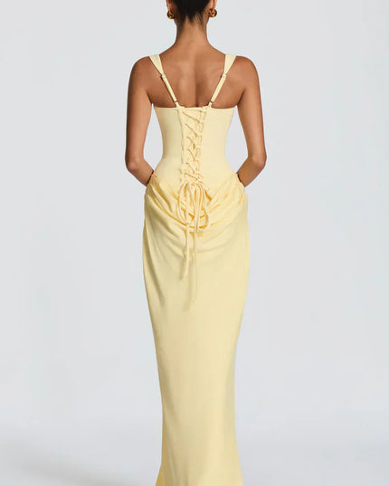Pale yellow corset maxi dress with lace-up back and draped waist, back view