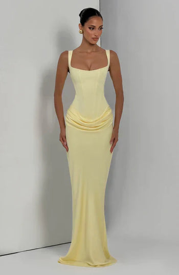 Pale yellow square neck corset maxi dress with fit and flowing hem, angled front view