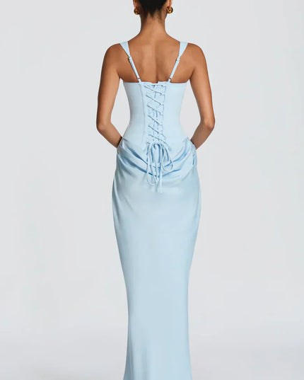 Back view of pale yellow corset maxi dress with lace-up closure and gathered skirt