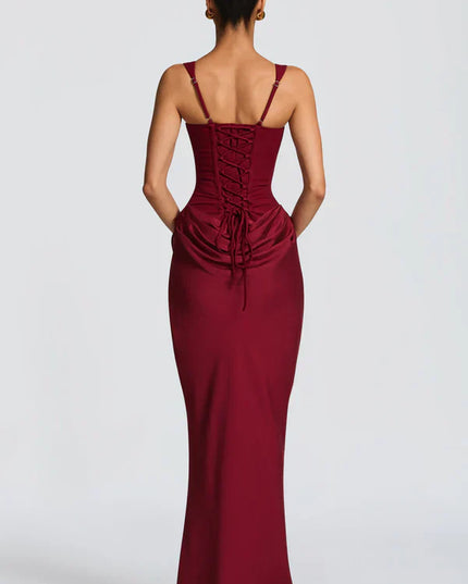 Back view of burgundy corset maxi dress with lace-up detail and ruched back waist