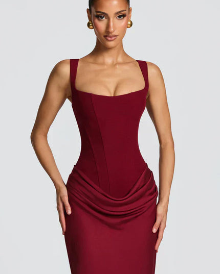Close front view of burgundy square neck corset maxi dress with defined seams and draped waist