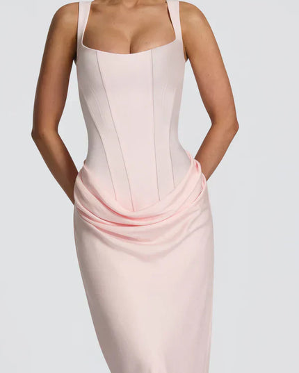 Closeup of pale pink square neck corset maxi dress with draped waist