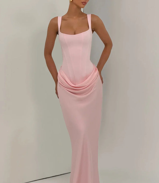 Blush pink corset maxi dress front view with draped skirt and straps