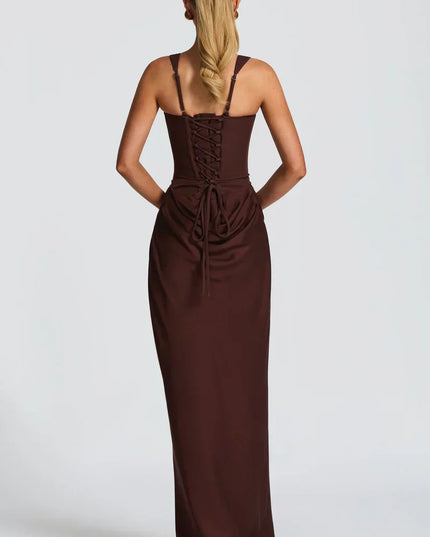 Side angle of chocolate brown square neck corset maxi dress with fitted silhouette and draped skirt