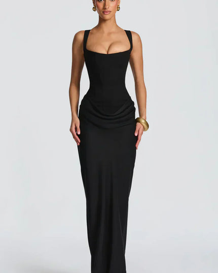 Chocolate brown square neck corset maxi dress worn indoors with draped skirt and fitted waist front view